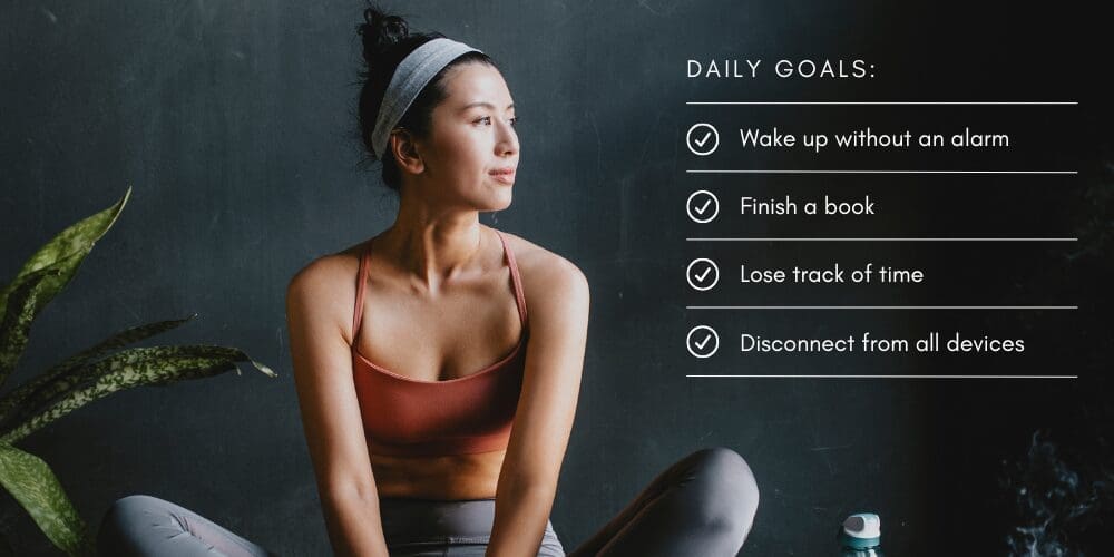 Woman sitting peacefully in activewear beside a list of wellness goals including waking without an alarm, finishing a book, losing track of time, and disconnecting from devices.